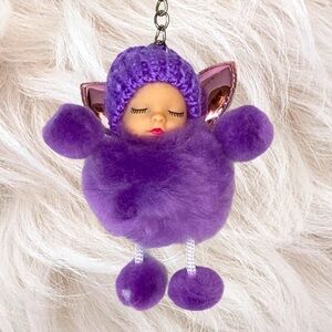 Sleepy baby with fairy wings small pompon in purple keychain charm key holder